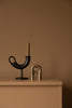 Scandinavian design. Ildhane candlestick in cast iron and Sammu candle snuffer in brass.