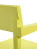 White background. Close up. Details of a bright yellow dining chair. Part of backrest and one arm rest is visible.