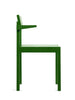 Green and minimalistic dining chair with arm rests on a white background. View is from the side.