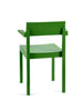 Minimalistic bright green chair in a white background. View from behind.