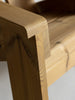 A close up of a outdoor lounge chair made from sustainably grown pine. White background.