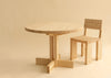 001 Dining table and dining chair by Vaarnii in Helsinki. Studio image with beige background.