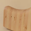 A close up image of a rocking toy in the shape of a seal. The rocking toy is made from pine. View from the side of its backend.