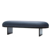 Product shot. A gorgeous danish bench on a white background. Black wooden legs and dark blue high quality leather seat.