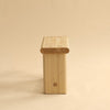 Sudio image. View from the side. 002 Ast Stool by Vaarnii ín Finland. Beige background.