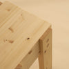 003 Stillts Side table. Studio image with beige background. Close up shot of the top corner.