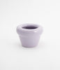 A small ceramic flower pot on a white background.