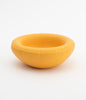 A round, yellow ceramic bowl on a white background. The bowl is empty.