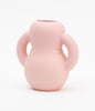 Pastel pink and friendly ceramic vase. White background.