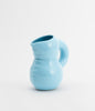 Glossy, baby blue ceramic water jug. Cute and soft forms. White background.