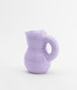 Glossy, mauve ceramic water jug. Very cute. White background.