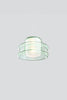 Modern pendant light with green glass shades on a plain background