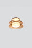 Modern pendant light with amber glass finish on a white background.
