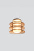 Modern pendant light with amber glass finish on a white background.