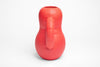 A side profile of a red pink ceramic vase with bold shapes. White background.