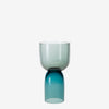 Two tones of turquoise. A gorgeous handmade glass vase on a white background.