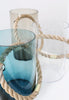Three beautiful glass vases. Similar shape but different colours. Blue, clear and pale brown.