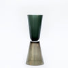 Tall and gorgeous handmade glass vase. Dark- and olive green with a clear middle. White background.