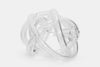 Sculpture made from clear handmade glass. White background.