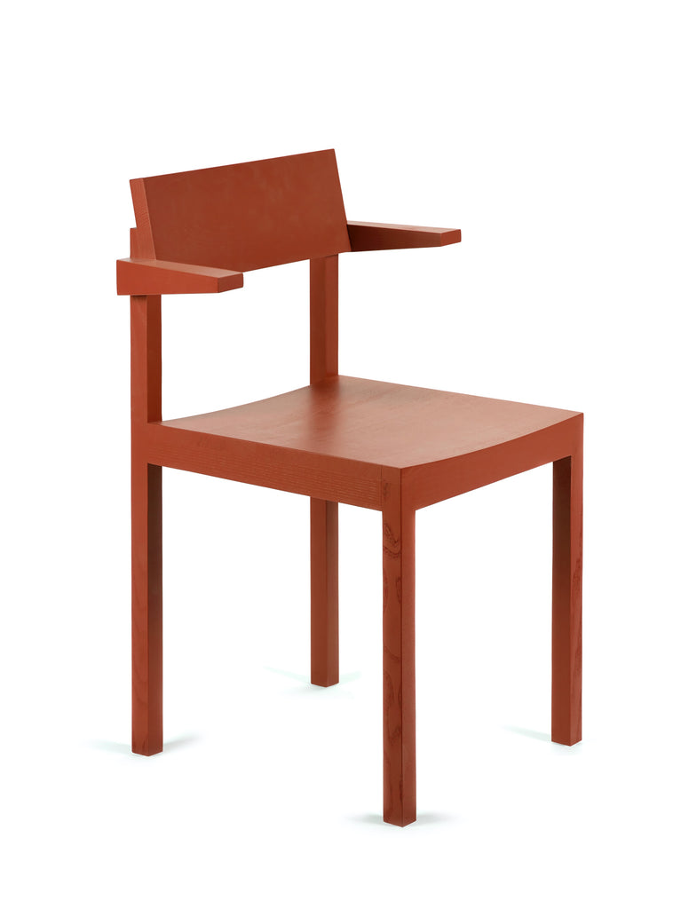 Red wooden dining chair with arm rests on a white background.