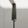 Ceiling light fixture with cylindrical design on a neutral background