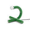 Modern green table lamp with a white bulb on a white background