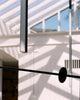Modern architectural interior with white beams and a glass ceiling