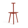 Red dining chair on a white background. View from behind.